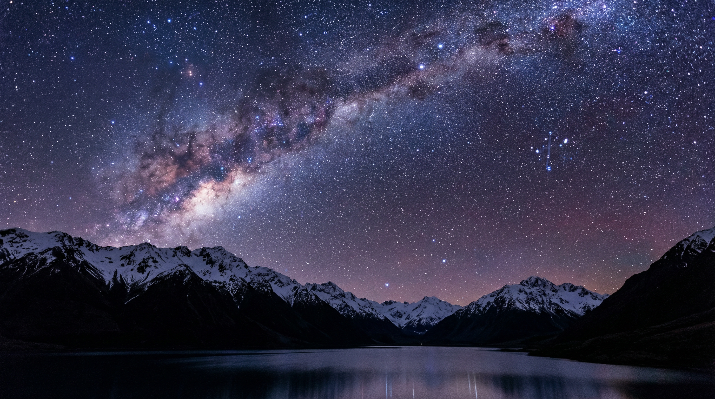Clear night sky with stars and Milky Way above mountain silhouette